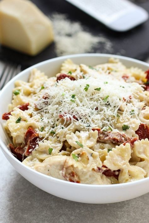 Creamy Sun-Dried Tomato Pasta with Chicken - A delicious and easy pasta meal! Farfalle pasta tossed in a cheesy cream-based sauce infused with garlic and butter, mixed with sun-dried tomatoes and baked chicken with Italian herbs. #easy #dinner #pasta #italian #farfalle #cheesy #whitesauce #recipe #joyousapron Tomato Pasta With Chicken, Italian Herb Chicken, Baked Chicken Strips, Sun Dried Tomato Pasta, Sundried Tomato Pasta, Pasta With Chicken, Farfalle Pasta, White Sauce Pasta, Italian Herbs