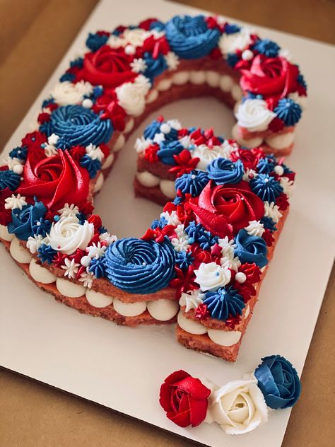 Fourth of July themed letter cake, 10” all buttercream #lettercake #buttercream #redwhiteblue #cakedecoratingideas #rosettes #strawberrycakes Red White And Blue Number Cake, July 4th Cake Decorating, 1st Birthday Fireworks Theme, Number 4 Cookie Cake, Usa Cookie Cake, Red White And Blue Cake Ideas, Red White And Two Birthday Cake, Red White And Blue Birthday Cake, July 4 Cake