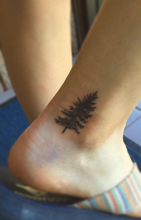 My small tree tattoo on my ankle, I am so pleased with the placement! Evergreen Trees Tattoo, Pine Tree Ankle Tattoo, Tree Tattoo Ankle, Pine Tattoo, Tattoo Script Fonts, Geometric Tattoo Arm, Deer Tattoo, Tree Tattoo Designs, Tattoo Designs For Girls