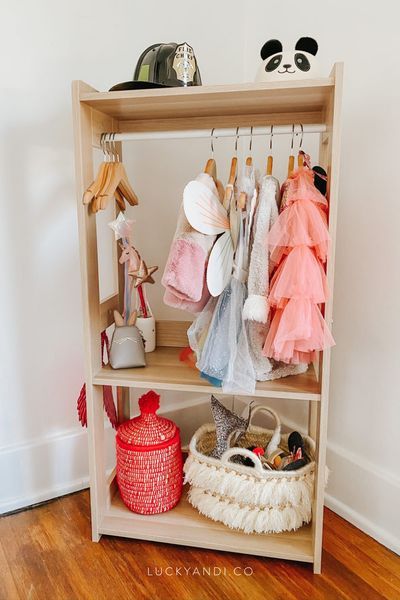 This is a great way of organizing kid's costumes. I found a minimal wood costume rack on Amazon and kid-sized wooden hangers. DIY Project: Kids Costume Dress Up Station. Lucky Andi Toddler Girl Dress Up Station, Toddler Dress Up Station, Wood Costume, Dress Up Area, Dress Up Stations, Toddler Dress Up, Dress Up Storage, Kids Dress Up, Diy Toddler