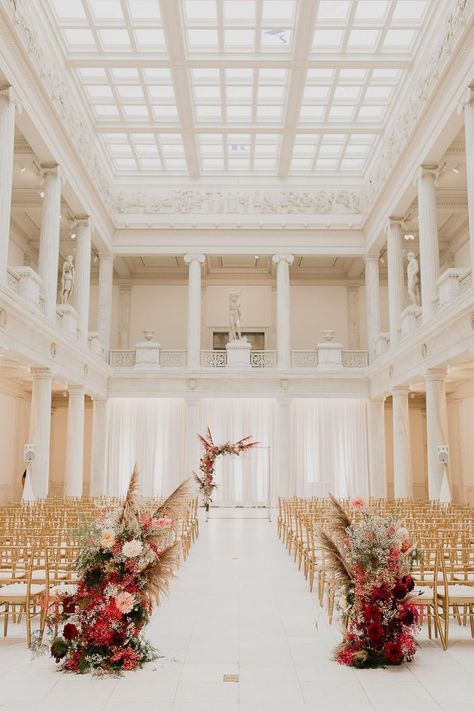 We can't take our eyes off of this stunning museum wedding ceremony decked in gold and whimsical florals| Image by Rachel Rowland Wedding In Museum, Museum Wedding Decor, Museum Wedding Aesthetic, Museum Wedding Ceremony, Carnegie Museum Wedding, Art Gallery Wedding, Art Museum Wedding, Carnegie Museum Of Art, Pittsburgh Weddings