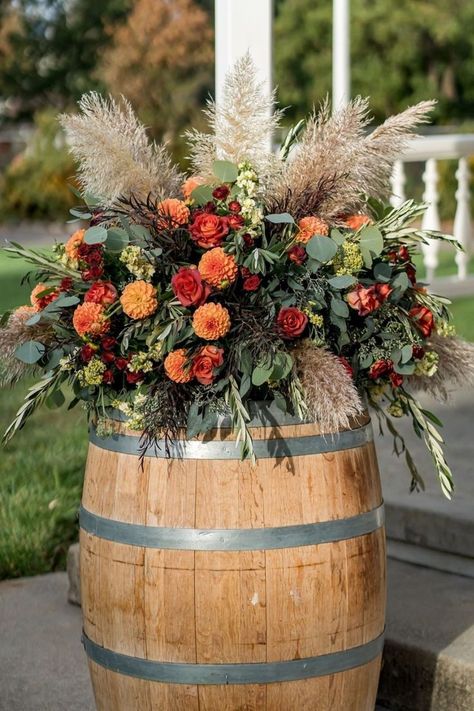 Discover stunning boho wedding florals to inspire your big day. From eclectic shapes to vibrant colors, these boho florals for wedding celebrations will bring a free-spirited atmosphere to your ceremony and reception. Explore our guide and find the perfect boho wedding flowers for your venue! Rustic Wedding Floral Arrangements, Fall Wedding Mums, Boho Floral Arrangements, Barrel Wedding Decor, Boho Wedding Florals, Florals For Wedding, Barrel Flowers, Whiskey Barrel Wedding, Country Wedding Flowers