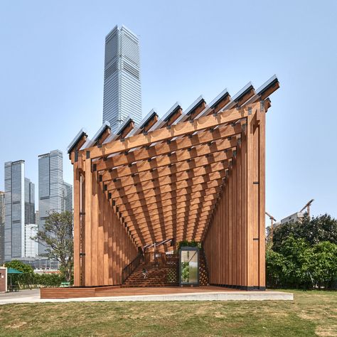 Timber pavilion unifies landscape and waterfront in West Kowloon district Mies Van Der Rohe Barcelona Pavilion, Water Pavilion, Timber Frame Pavilion, Wooden Pavilion, Barcelona Pavilion, Roof Cladding, Pavilion Plans, Pool Pavilion, Glass Pavilion