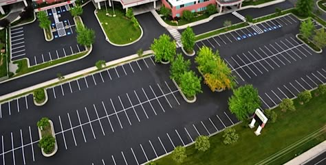 I really like this picture because of the pattern of the parking lot. The asphalt contrasts with the nature of the trees surrounding it. It's a really cool aerial shot! Parking Lot Design, Car Park Design, Parking Lot Striping, Parking Plan, Landscape Architecture Park, Urban Spaces Design, Parking Lot Architecture, Streetscape Design, Parking Building