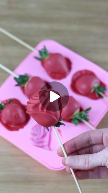 Sheri Wilson on Instagram: "I’ve seen this trend circulating and thought it was so clever!🌹Chocolate covered strawberries, but roses! Would you try these? Ingredients -Ghirardelli white chocolate wafers -colourmill red food coloring (oil based) -strawberries, washed and dried -small rose mold Melt your chocolate wafers in the microwave for 30 second bursts until fully melted. Add an oil based red or pink food coloring to your chocolate, then mix until fully incorporated. Press a skewer into each strawberry, then place on a paper towel to wick any moisture before dipping. Pour a small amount of chocolate into your mold, then place a dipped strawberry into each cavity. Place into the fridge to set for 5-10 minutes. Enjoy the same day as prepared. #valentines #treats #valentinesday Chocolate Rose Strawberries, Rose Chocolate Strawberries, Chocolate Covered Rose Strawberries, Rose Strawberries Chocolate, Chocolate Strawberry Decorations, Chocolate Covered Strawberries Skewers, Easy Chocolate Dipped Strawberries, Red Dipped Strawberries, Strawberry Desserts Chocolate