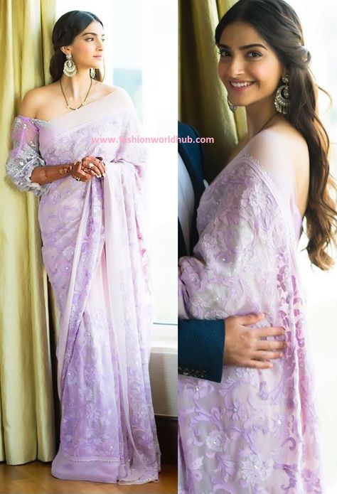 Sonum Kapoor in Lavender lilac  shadow work saree with crystal embellishment  Paired with bishop sleeve  lace, off-shoulder blouseand she further enhanced her look with short black beeds and statement ear rings. Center parted hair and pink lips rounded her look. Lavender Designer Saree, Lilac Organza Saree, Lilac Sarees, Lavender Sarees, Lavender Organza Saree, Roka Outfits, Lilac Saree, Sabyasachi Dresses, Lavender Saree