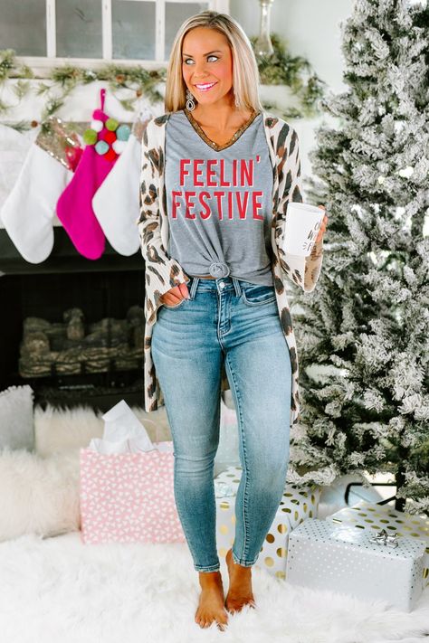 Get in the holiday spirit in new holiday graphic tees! Open presents, look at Christmas lights, sit by the fire, go Black Friday shopping, this shirt will be your go-to all holiday season long! #holidaygraphictees #Christmasoutfit #womensholidayoutfit #holidayparty Holiday Graphic Tees, Gameday Couture, Post Holiday, Graphic Tee Outfits, All Christmas, Nfl Outfits, Christmas Pjs, Dressy Dresses, V Neck Top