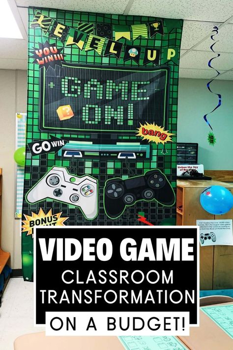 This picture shows a classroom decorated for a video game classroom transformation day and has decorations to go with it. It shows a video game tarpaulin hanging from the ceiling. Roblox Classroom Theme, Game On Classroom Theme, Gaming Classroom Decor, Staar Themes Ideas, Gamer Classroom Theme, Level Up Classroom Theme, Game On School Theme, Video Game Classroom, Classroom Transformation Ideas