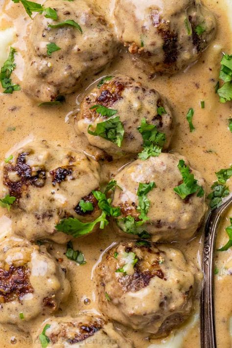 Juicy and tender meatballs with a hint of allspice and nutmeg in a rich sauce. A copycat recipe for the popular IKEA recipe. Sweetish Meatballs Recipe, Recipe For Swedish Meatballs, Meatballs Sauce Recipe, Swedish Meatballs Recipe, Meatballs And Gravy, Tender Meatballs, Over Mashed Potatoes, Italian Meatballs Recipe, Meatball Sauce