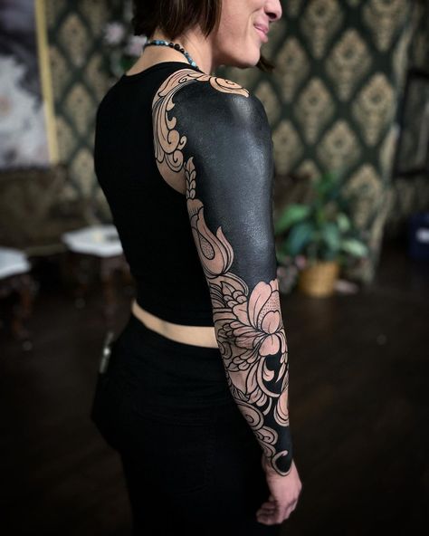 Blacked Out Half Sleeve Tattoo, Black Tattoo With White Ink On Top, Tricep Cover Up Tattoo, Black Out Arm Tattoo Half Sleeves, Dark Half Sleeve Tattoo, Blackout Shoulder Tattoo, Blackout Half Sleeve Tattoo, Floral Blackout Tattoo, Blackout Tattoo Women