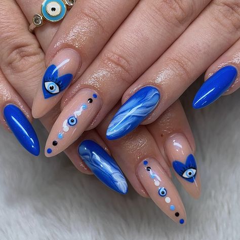 evil eye nails 🧿🫶🏼✨💙 acrylic fill w/ nail art done on tja brand ambassador @tayxanne <3 @youngnailsinc - cover pink @dndgel @dndgel.europe - dc 055 black ocean - dc 056 white chalk - dc 027 pittsburgh blue - dc 030 aqua blue @apresnailofficial - heavenly top coat divine #evileye #evileyenails #evileyenailart #evileyenails🧿 #bluenails #bluenailart #blueacrylics #marblenails #chromenails #bluechromenails #acrylicnails #longacrylicnails #almondnails #ontariocanada #youngnails #youngnails... Blue Eye Nail Art, Evil Eye Nail Art Design, Almond Nails Evil Eye, Red Evil Eye Nails, Hamsa Nails, Ojo Nails, Pink Evil Eye Nails, Turkish Eye Nails, Egyptian Nail Art