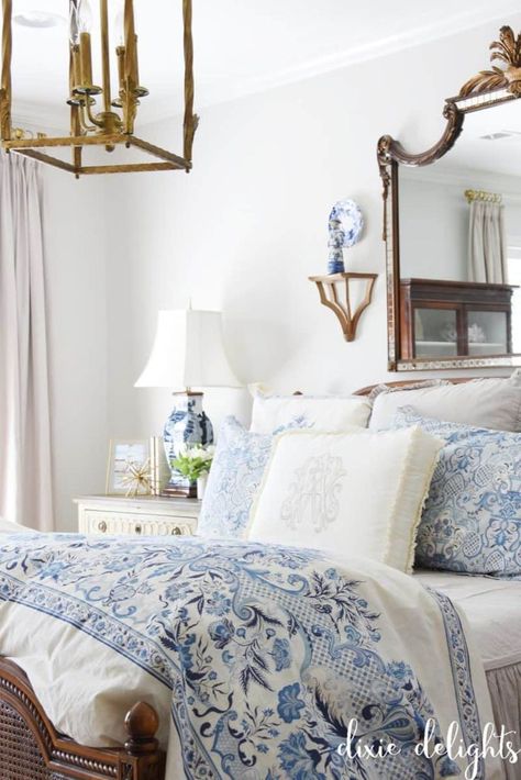 Master Bedrooms Southern, Southern Chic Bedroom Ideas, Blue And White Bedroom With Dark Furniture, Modern Grandmillenial Bedroom, Master Bedrooms Decor Blue And White, Traditional Blue And White Bedroom, Grandmillenial Nightstand, Blue Southern Bedroom, Grand Millennial Bed