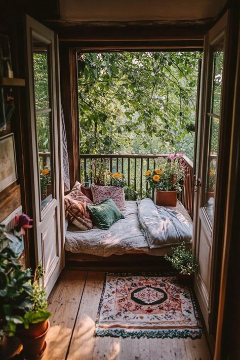 View from inside a rustic cottagecore style room to a small balcony the balcony has a daybed with pillows and throws potted plants and flowers. Discover the perfect dream cottage houses with cozy interiors, charming exteriors, and enchanting gardens. Cottagecore Houses Interior, Tiny Farmhouse Bedroom, Tiny Home Cottagecore, Cottagecore House Modern, Witchy Cottagecore House, Small Cottagecore House, Tiny Home Decorating Ideas Small Houses, Fairytale Cottage Aesthetic Interior, Cute Cottage House Interior