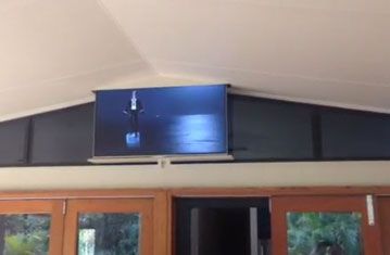 Large Screen TV Drops Down from Ceiling Ceiling Tv Mount, Patio Tv, Fireplace Tv Mount, Savings Ideas, Ceiling Tv, Tv Lift, Outdoor Kitchen Plans, Tv Mount, Kitchen Plans