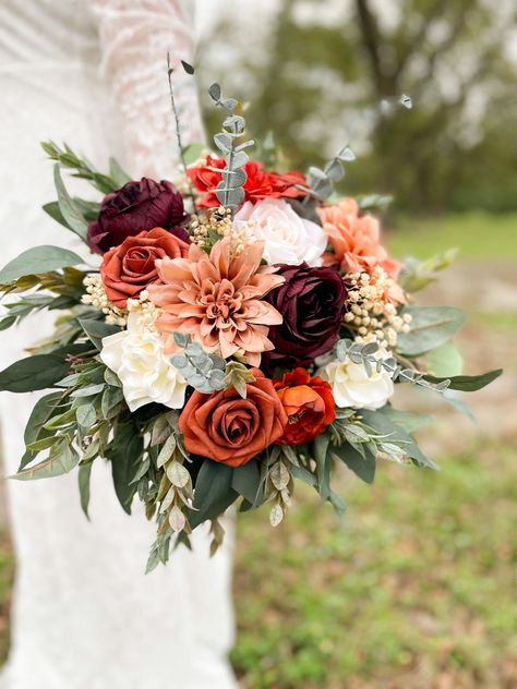 These STUNNING arrangements are made from high quality silk and foam flowers. Get the look of real flowers without the astronomical price!  Bridal measures approximately 16"  There are wrapped very thoroughly with floral tape and ribbon Production time is 3-5 business days. One week for shipping. I do offer rush options Burnt Orange Bouquet Fall Weddings, Burgundy And Orange Wedding Flowers, Rust Wedding Flowers, Terracotta And Burgundy, Terracotta Wedding Bouquet, Fall Flower Wedding Bouquets, Orange Wedding Themes, Burnt Orange Wedding, Fall Wedding Bouquet