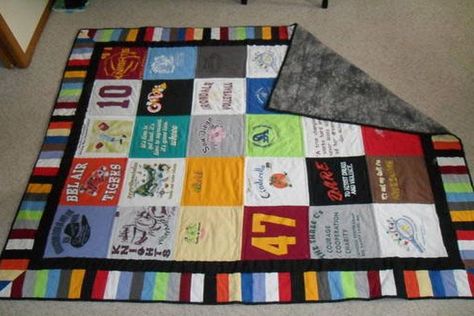 DIY T-Shirt Quilt ( No Sewing! )  Do you know someone who owns a lot of t-shirts, but can’t seem to let them go? Each t-shirt came from a special moment in time: high school baseball team, theatre club, volunteering, traveling to different countries, etc. We know it’s hard to part with items that carry a memory, but why not make your t-shirts useful and long lasting? T-shirt quilts are great for birthday’s, Christmas and ...   #digitization #southtree #memoriesmatter #declutter #digitize #preser T-shirt Quilts, Tee Shirt Quilts, Tshirt Quilts, Tee Shirt Quilt, Tshirt Blanket, Shirt Quilts, T Shirt Quilts, Memory Quilts, Tshirt Quilt