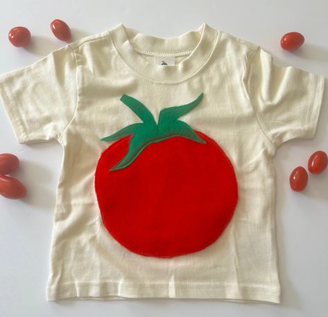 These natural cotton tees are the perfect casual baby & toddler tees, featuring comfy crew necks & soft, breathable fabric.  The Tomato is hand appliqued by me using a plush fleece fabric and washable felts made from recycled plastic bottles. Feels soft and comfy to touch. Like wearing a stuffed animal on your tummy. My hand block printed labels and fruit bag packaging  just add to the fun. This is going to be a favorite tee!! Great hand-me-downs to keep in the family or give as gifts!!  The tee Hand Sewn Clothes, Womens Work Shirt, Fruit Bag, Secondhand Style, Applique Tee, Cute Sewing Projects, Patchwork Top, Diy Fashion Clothing, Sustainable Fabric