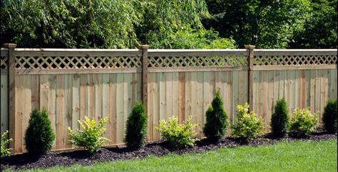 55 Lattice Fence Design Ideas (Pictures of Popular Types) Here are our best lattice fence design ideas. A lattice fence can offer privacy, security and help your backyard look more inviting to family and friends. Looking for a way to enclose your yard but hate the restrictive feel of tall privacy enclosures? Do you want security within your property but feel that stockade style fences are too plain for your landscape? Then lattice fences may be the right fence style for you. Below we share a v Fence With Lattice Top, Privacy Fence Landscaping, Wood Privacy Fence, Privacy Fence Designs, Lattice Fence, Backyard Privacy, Fence Styles, Diy Fence, Front Yard Fence