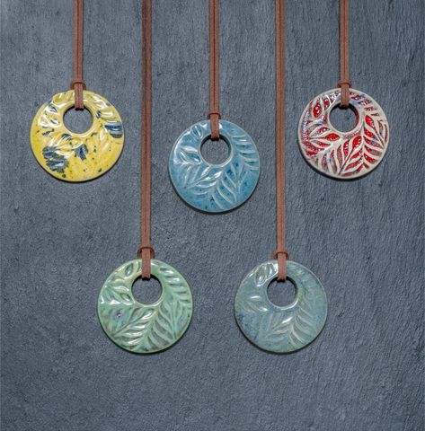 Ceramic pendants in a stylish, bold design. Available in 5 colours with a subtle embossed pattern. Ceramic piece measures 55mm in diameter. A brown faux leather cord can be tied to your desired length. Pottery Pendants, Baking Polymer Clay, Ceramic Pendant Necklace, Ceramic Pendants, Ceramics Pottery Bowls, Handmade Ceramic Jewelry, Polymer Clay Bracelet, Pattern Ceramic, Handmade Clay Jewelry