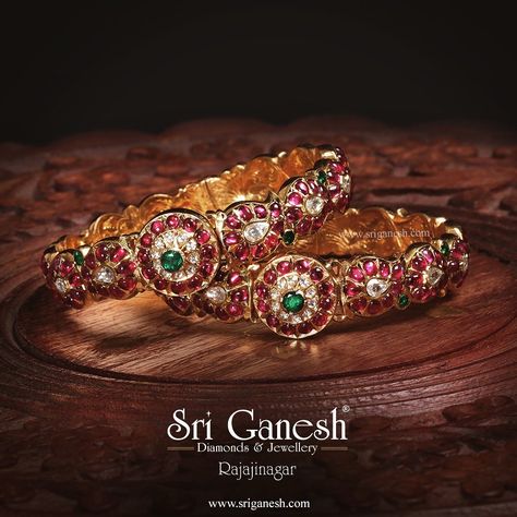 This pair of real antique bangles are made in 22karat gold studded with Burmese rubies, Zambian Emeralds and Rose cut diamonds using an ancient stone-setting technique which was synonymous only in South India. These bangles truly define the traditions and vast heritage of South Indian Jewellery. Gold Ruby Bangles Design, Ruby And Emerald Bangles, Emerald Bangles, South Jewellery, Antic Jewellery, Ruby Necklace Designs, Antique Bangles, Sri Ganesh, 22 Carat Gold Jewellery