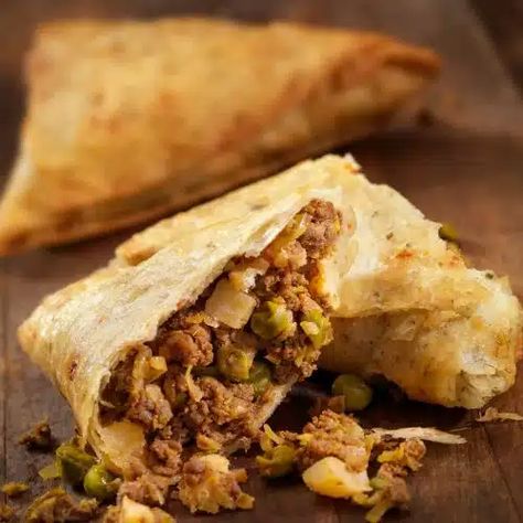 Kenyan Beef Samosas - Chef's Pencil Beef Samosa, African Cooking, Savory Pie, Christmas Dishes, Tikka Masala, Samosa, Frozen Peas, African Food, Fresh Cilantro