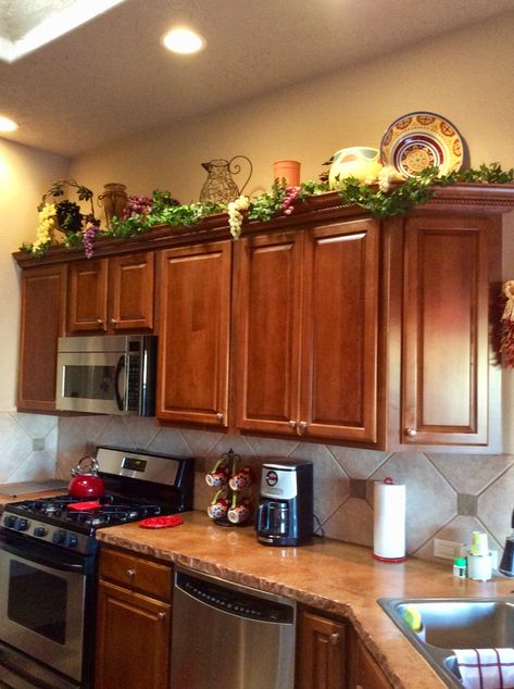 Decorating above the kitchen cabinets. Flowers Above Kitchen Cabinets, On Top Of Cabinet Decor, Decorating Over Kitchen Cabinets, Classy Kitchen Decor, Above Cupboard Decor, Top Of Kitchen Cabinet Decor, Kitchen Ledge, Decorating Above Kitchen Cabinets Ideas, Tuscan Kitchens