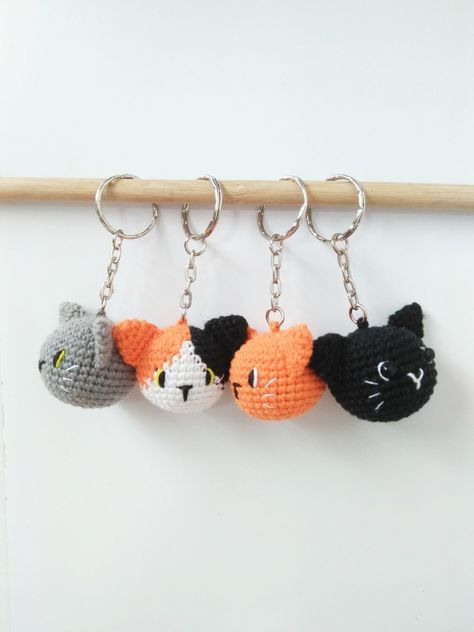 Four crochet cat head amigurumi as a keychain Cat Amigurumi Keychain, Crochet Market Stall, Ginger And Black Cat, Cat Head Crochet, Cat Crochet Keychain, Cat Keychain Crochet, Crochet Key Chains, Crochet Cat Keychain, Black Cat Crochet