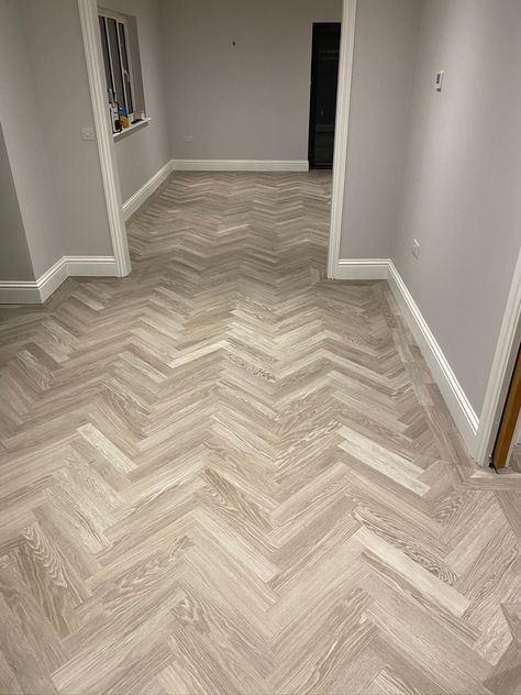 A Karndean Knight Luxury Vinyl Tile in grey limed oak colour. Herringbone design with a double plank boarder edge Small Bathroom Parquet Floor, Herringbone Karndean Flooring, Greige Herringbone Floor, Karndean Parquet Flooring, Karndean Flooring Living Room, Downstairs Flooring Ideas, Karndean Herringbone Flooring, Lvt Herringbone Flooring, Karndean Herringbone