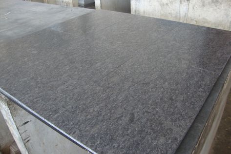 Steel grey granite slab in a leather finish with a mix of light and dark grey shades. #granite #greygranite #slabs #architecture #granitecolor #southindia Steel Grey Leathered Granite Countertops, Steel Grey Granite Countertops, Steel Grey Leathered Granite, Steel Grey Granite, Dark Grey Granite, Farmhouse Finishes, Absolute Black Leathered Granite, Leathered Granite Countertops, Galactic Black Honed Granite