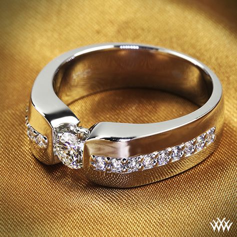 This Custom Men's Diamond Wedding Ring is set in Platinum and holds 0.70ctw A CUT ABOVE® Hearts and Arrows Diamond Melee along the shank. The center 0.40ct A CUT ABOVE® Diamond is secured by a half-bezel set. Mens Rings Wedding Diamond, Wedding Wednesday, Mens Diamond Wedding Bands, Half Bezel, Ruby Rings, Emerald Rings, Custom Wedding Rings, Emerald Pendant, Diamond Wedding Ring