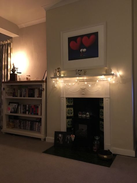 Fairy lights are the perfect addition to my fireplace 😍 there's no place like home 🏡❤️ Fairy Lights Around Tv Stand, Fairy Lights Tv Room, Fairy Lights Tv Stand, Mantle Fairy Lights, Bookcase Fairy Lights, Mantelpiece Fairy Lights, There's No Place Like Home, No Place Like Home, Twinkle Lights