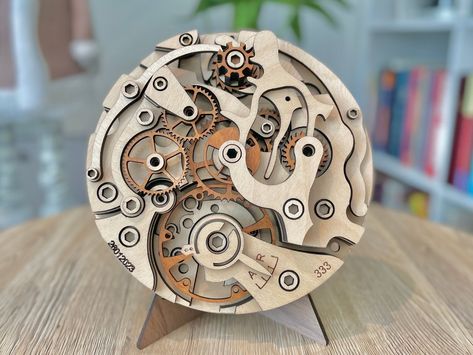 My adoration for mechanical watches goes beyond their metallic casing; it's the intricate inner workings that truly captivate me. To pay homage to this fascination, I designed an art piece inspired by various mechanical watches. Constructed from multiple layers of wood, this artwork boasts a diameter of 305mm. Its one-of-a-kind multilayer mandala design makes it a striking addition to any living space, be it as home decor or wall art. This piece also serves as a thoughtful and original gift for Mechanical Watch Movement, Mandala Decoration, Watch Wood, Basic Sketching, Watch Art, Gear Clock, Cnc Art, Mechanical Clock, Gear Art