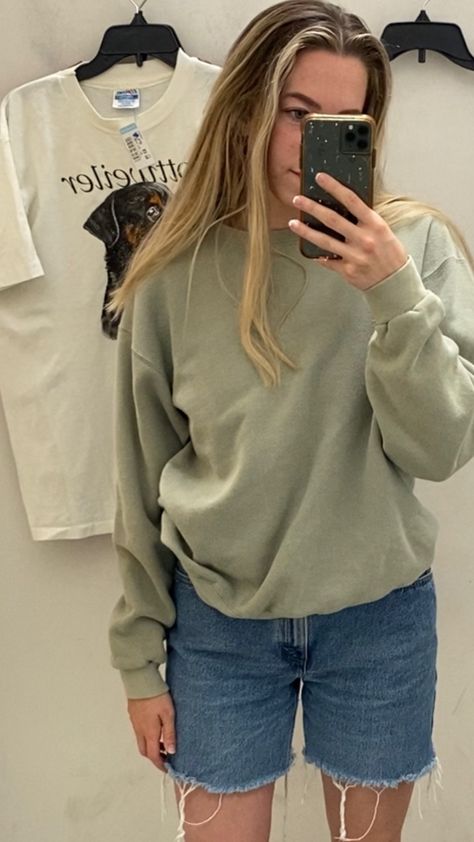 thrifted oversized 90s light sage green sweat with vintage denim shorts Sage Green Sweatshirt Outfit, Light Green Sweatshirt Outfit, Earthy Wardrobe, Green Sweatshirt Outfit, Oversized Green Sweater, Green Oversized Sweater, Denim Shorts Outfit, Outfits Primavera, Vintage Denim Shorts