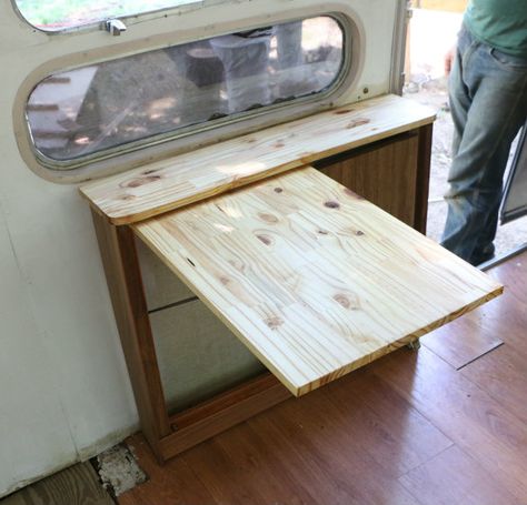 Project Airstream: Renovation Continues! | 17 Apart Airstream Kitchen Ideas, Airstream Storage, Fold Out Table, Diy Console, Airstream Campers, Airstream Remodel, Airstream Renovation, Rv Renovations, Curtain Hardware