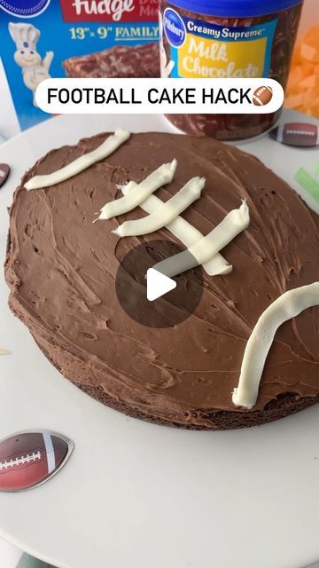 Pillsbury Baking on Instagram: "3....2....1.... Football brownie hack is headed your way!🏈⁠
⁠
Save this recipe to make it for the big game! 🎉⁠
⁠
You’ll need...⁠
1 box of Pillsbury Brownie Mix⁠
Additional ingredients according to box instructions⁠
1 tub of Pillsbury Milk Chocolate Frosting
1 tub of Pillsbury White Frosting
Piping bag ⁠
Flat piping tip⁠
⁠
Directions:⁠
1. Preheat oven to 350F. Prepare brownie mix according to box instructions. Bake your brownie mix in a 9” pan. Let cool completely.⁠
⁠
2.  Cut a sliver out of the center. Piece together the outside to make the football shape.⁠
⁠
3. Frost football with chocolate frosting and pipe lines on with the white frosting to create the “football”. Serve and enjoy!" Football Brownies, Brownie Hacks, Frosting Piping, Chocolate Footballs, Milk Chocolate Frosting, Piping Tip, Cake Hacks, Football Cake, White Frosting