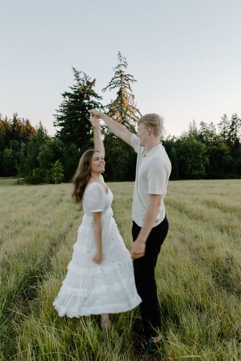 White dress engagement photoshoot outfit Engagement Dress Aesthetic, White Dress Couple Photoshoot, White Dress Engagement Pictures, White Dress Engagement, Engagement Photoshoot Outfit, White Flowy Dress, Dress Engagement, Engagement Pic, White Long Skirt