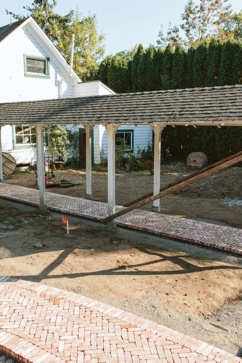 Exterior Update: Our Herringbone Brick Patio Is *Almost* Installed - Emily Henderson Herringbone Brick Patio, Brick Installation, Front Portico, Herringbone Brick, Brick Border, Chickens In The Winter, Brick Patio, Fire Pit Area, Concrete Pavers