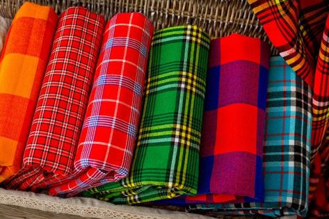 Colorful plaids of the masai tribe. afri... | Premium Photo #Freepik #photo #background #blue-background #gift #green Masai Tribe, African Table, Maasai Shuka, Tree Fashion, Maasai People, Ocean Sports, Russian Vintage, African Flag, Patchwork Scarf