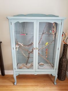 My very first DIY indoor aviary that I repurposed from an old china cabinet. Branches are natural from the trees in my backyard. Bird Avery, Indoor Aviary, Old China Cabinet, Bird Cage Ideas, Reuse Furniture, Animal Enclosures, Budgie Cage, Diy Bird Cage, Mouse Cage