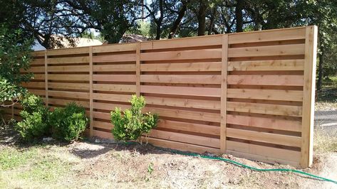 Horizontal shadow box fence built by Landmark Fence Shadow Box Privacy Fence, Shadow Box Horizontal Fence, Shadow Box Fence Ideas, Wood Porch Railings, Shadow Box Fence, Fence Types, Glass Railing Deck, Fence Planning, Horizontal Slat Fence