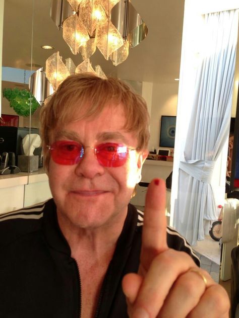 Posted by David Furnish  " YOUR LOVE IS IN MY BLOOD Please share with everyone @eltonjohnaidsfoundation " This seems to be some type of fundraiser, trying to get people to take selfies like this and post them to Twitter. Elton John Album Covers, Rocketman Movie, David Furnish, Bernie Taupin, Goodbye Yellow Brick Road, Captain Fantastic, Rock Girl, Piano Player, John 3