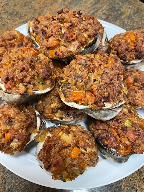 Transport yourself to the seaside with this delectable recipe for Baked Stuffed Clams. Bursting with flavors of the ocean and savory ingredients, these delightful bites are perfect for any seafood lover or appetizer enthusiast. Fresh clams are carefully prepared, stuffed with a savory mixture of bacon, onions, bell peppers, and herbs, then baked to perfection. […] Baked Clams Recipe, Baked Clams Oreganata, Stuffed Clams, Baked Clams, Clams Recipe, Fresh Clams, Sausage Ragu, Clam Bake, Clam Recipes