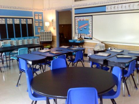 These desks were covered in contact paper on to hide their worn out-ness.  I love the blue color scheme. Ocean Theme Classroom, Classroom Pictures, Desk Cover, Classroom Tables, Desk Layout, Classroom Organisation, Blue Room, Organization Decor, New Classroom