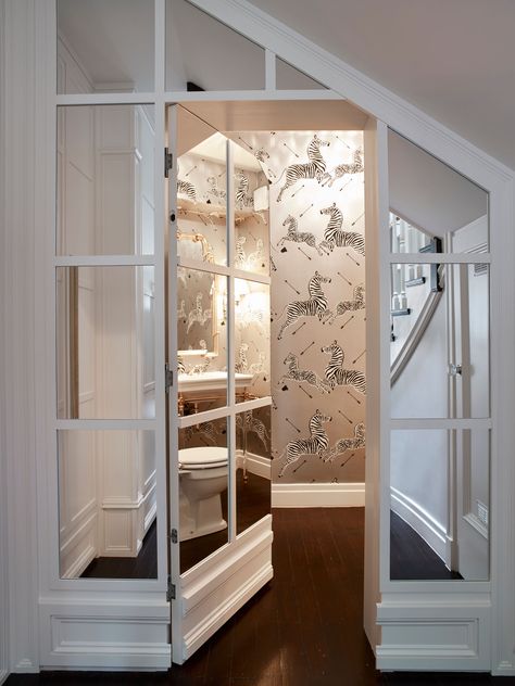 A hidden powder room behind a mirrored wall. The feature wallpaper pops out when you open the door. #design #interiordesign #powderroom #zebrawallpaper Hidden Pantries, Laundry Hidden, Hidden Rooms In Houses, Secret Door Ideas, Hidden Door Ideas, Doors Decoration, Door Remodel, Hidden Doors In Walls, Hidden Closet