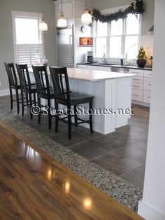 interesting transition between the tile & the wood floors.  Google Image Result for www.stratastones.... Transition Flooring, Pebble Tile, Kitchen Floor Tile, Kitchen Tile, Kitchen Redo, Kitchen Floor, Trendy Kitchen, Room Flooring, Kitchen Remodel Idea