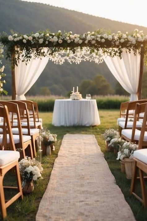 Are you dreaming of a beautiful spring wedding that won't cost a fortune? Dive into our simple and easy ideas for an elegant yet affordable celebration. Picture a charming outdoor setup with white folding chairs, a rustic wooden arch filled with bright flowers, and twinkling lights setting the mood. You'll discover how to plan stylish decorations, keep costs down, and still say 'I do' in style this spring. Perfect for brides wanting a lovely day without the big price tag! Save this pin for all the budget wedding inspiration you need. Wedding Venue Ideas Ceremony, Outside Wedding Inspiration, Wedding Ideas Field, Spring Wedding Outside, Spring Wedding Venue Ideas, Backyard Wedding Inspiration, April Wedding Ideas, Spring Wedding Outdoor, Spring Wedding Ceremony