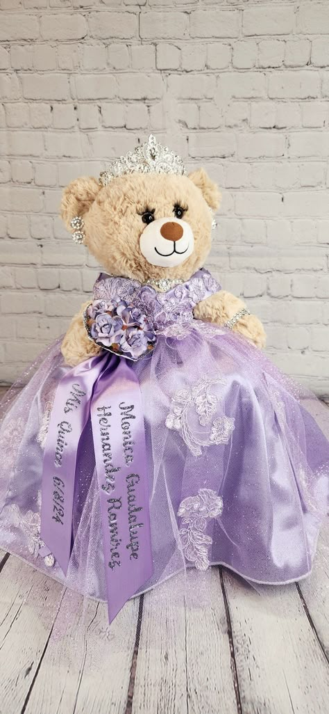 Custom Personalized Quinceanera Bear/Last Doll/Oso made to look just like the quinceanera's dress. Attention to detail is my forte.  Includes the 20" bear, dress, tiara, lashes, bouquet and jewelry. Please allow more than 8 weeks to make the bear.  May be longer during peak season.  Please message me with the following information: - Pictures of the front and back of the dress. - Color description as sometimes the pictures may appear differently.  - Date of the Quinceanera - Color of accessories (silver, gold, rosegold) - If you need it sooner than 8 weeks, please select the Rush Fee and add it to the cart. - If you would like the additional accessories, please add the accessory upgrade to the cart.  Upgrade includes metal tiara with stones, heels to match her dress, and doll stand so that Build A Bear Quinceanera Dress, Quinceanera Bear Purple, Quinceanera Doll Purple, Tangle Quinceanera Theme, Sofia The First Quinceanera, Quince Last Doll, Repunzel Quince Theme, Rapunzel Theme Quinceanera, Light Purple Quinceanera