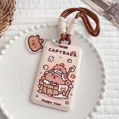 Elevate your accessory game with our Kawaii Capybara ID Card Holder, a delightful and functional addition to your daily essentials. Showcasing a cute capybara meme design with adorable food art, this holder brings a touch of kawaii charm to your everyday routine while keeping your ID or cards conveniently at hand. ◆ Adorable Capybara Meme Design: Immerse yourself in the cuteness of capybara memes, as this ID card holder features a kawaii design that adds a playful and charming touch to your dail Capybara Meme, Cute Card Holder, Kawaii Capybara, Adorable Food, Cute Ipad Cases, Cute Capybara, Cute Bunny Cartoon, Cute Snacks, Accessories Cute