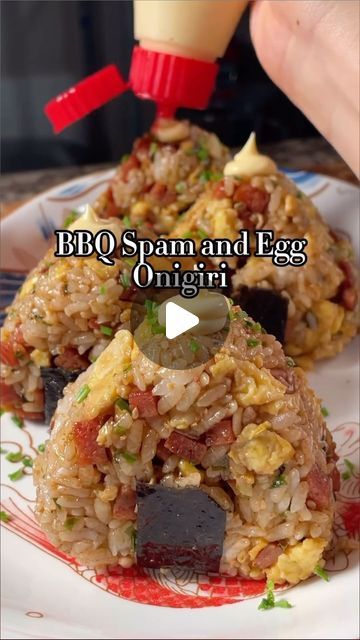 Oahu Family Fun - Activities & Events on Instagram: "Mmmm….spam fried rice musubis!  I gotta get me one of those triangle molds. Yum! 🤤   @buzzfeedtasty The perfect picnic food! 🍙 Ingredients: -1 cup rice, cooked -½ can Spam, cubed -1 Tbsp soy sauce -1 Tbsp sugar -2 Tbsp bbq sauce -3 eggs -spray oil -4 Tbsp furikake  Garnish: -chives -kewpie mayo -seaweed strips  Steps:  1. Cook rice according to package instructions and set aside to cool. 2. Cube spam into small bites, set aside. 3. In a large pan on medium heat, spray with cooking oil before adding spam. Toast on all sides until slightly brown, about 3 minutes. 4. Add in the soy sauce, sugar, and bbq sauce, and cook for another 3 minutes or until the sauce thickens to liking. Remove and set aside. 5. In a bowl, mix your eggs to scrambl Spam And Egg Musubi, Fried Spam Recipes, Spam Eggs And Rice, Spam Rice Balls, Spam Musubi Bowl, Asian Food Party, Rice With Spam, Onigiri Recipes, Musubi Spam