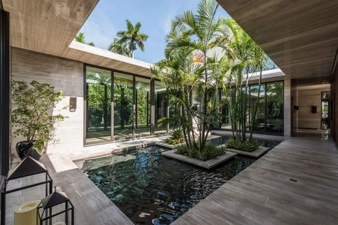 A centralized reflecting pool with floating planters creates a unique feature viewed from the interior of the Residence. Japanese Courtyard House, Contemporary Water Feature, Native Grasses, Indoor Courtyard, Environmentally Friendly Living, Pool Landscape Design, Courtyard House Plans, Dream Yard, Architecture Model House